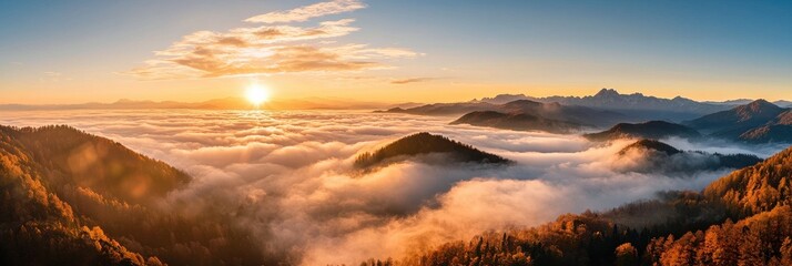 The sun is setting over a mountain range with a thick layer of fog