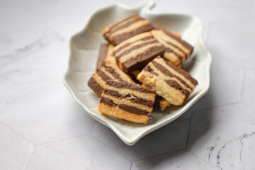A plate of Striped Butter Cookies atau Biskut Belang.  Butter cookies are popular served during Hari Raya (Eid Mubarak) in Southeast Asia countries.