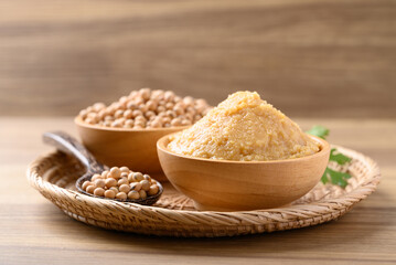 Miso paste in wooden bowl, Japanese seasoning made from fermenting soybeans with salt, Traditional food ingredient in Japanese cuisine
