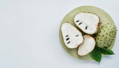 Sliced cherimoya fruit on a wooden board.