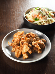 fried batter fish served with spicy green mango salad