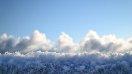 Snowy Landscape with Clouds Under a Clear Blue Sky at Sunrise