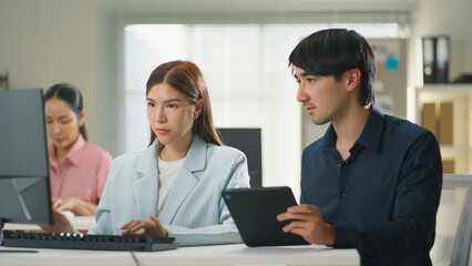 Obraz premium Finance Business Strategy, Market Reports, Data Analytics Investment Planning, Two busy colleagues working together using laptop, Creative Business team brainstorming,