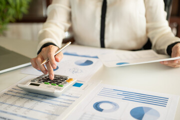 accountant or business people are calculate valuation and appraisal value of property business company and stock.