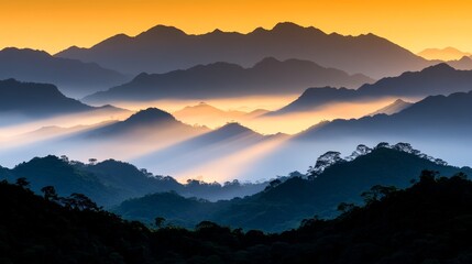 Golden Sunrise Rays Illuminate Misty Mountain Ranges