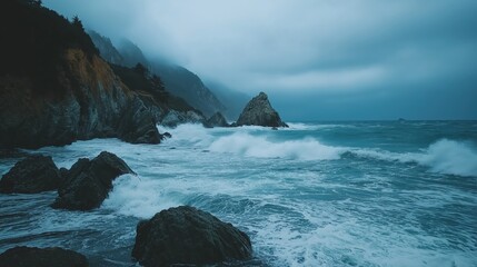 Obraz premium Dramatic Coastal Scene Dark, Moody Waves Crashing Against Rocky Shoreline Under a Stormy Sky