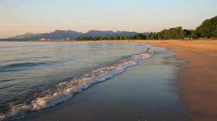 Serene Sunset Beach Landscape Golden Light and Calm Ocean Waves