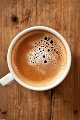 Fototapeta premium Aromatic Coffee in White Mug on Wooden Table