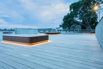 illuminated platform on large deck on city waterfront