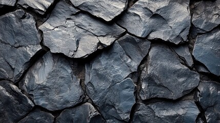 Close-up view of textured dark slate rock surface.