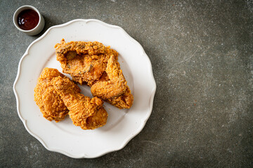 fried chicken with ketchup on plate