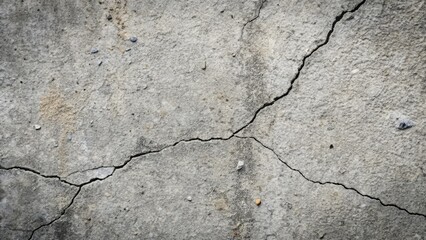 Obraz premium Rough textured concrete surface with a mix of small and large cracks, weathered, stone-like, aged