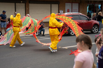 chinese new year festival the street playing a red drum in australia
