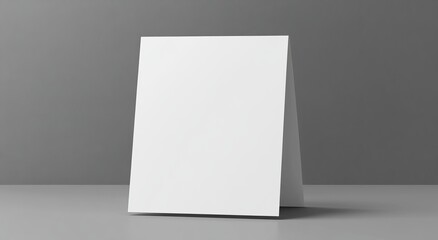 Blank white tent card mockup on gray background.