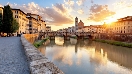 Obraz premium historic stone bridge in Florence bathed in warm golden light at sunset