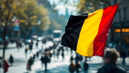 Belgian Flag Waving in City Crowd Background