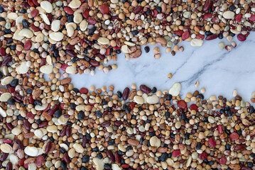 Mixed dried legumes: peas, lentils, beans, haricot, buckwheat, chickpea. food texture background, Top view image.