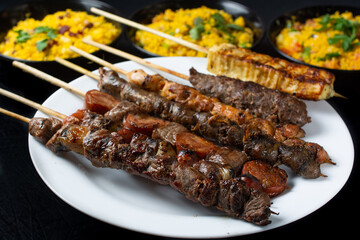 barbecue on a stick. Very common street food all over the world. Meat, chicken, sausage, chicken hearts, kafta, curd cheese and farofa. Espetinho