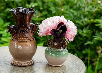 still life with a clay vase, decorative clay dishes, handmade, craftsman concept, interior items,...