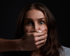 Studio, woman and scared with hand for abuse, domestic violence and anxious in portrait for...