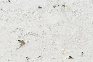 Peeling paint texture of white cement wall. Rugged background.