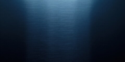 Fototapeta premium Close-up of lustrous, dark blue brushed metal; its sleek, glossy finish reflects light elegantly