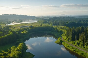 Obraz premium Serene Landscape of Lush Green Forests and Calm River Under a Clear Sky During Daylight with Reflection on Water Surface