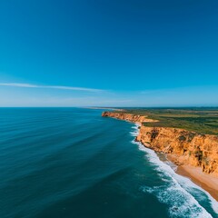 Aerial View of a Sunny Coastal Scene with a Rugged Cliff