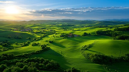 Obraz premium Aerial View of Lush Green Rolling Hills at Sunset