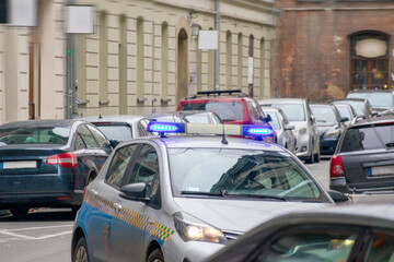 
a large number of cars parked on the street. The cars are of different colors and makes, and they are placed close to each other.