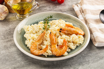 Italian risotto with prawn served thyme