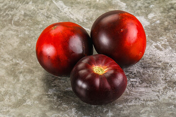 Black ripe juicy organic tomato