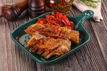Baked lamb ribs with vegetables