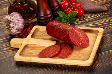 Spicy pepperoni sausages with sliced piece