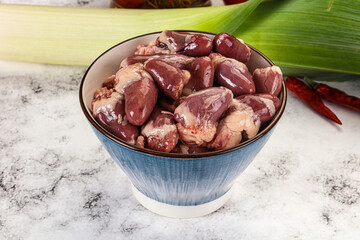 Raw chicken hearts in the bowl
