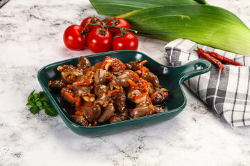 Baked chicken hearts with vegetables