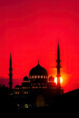 Fototapeta premium Majestic Mosque Silhouette at Sunset: A Fiery Red Artistic Depiction