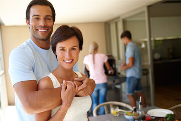 Happy couple, hug and portrait for holiday, vacation or weekend barbecue at home with friends. Man, Woman and break with embrace for joy, comfort and casual day off at house or apartment for bonding