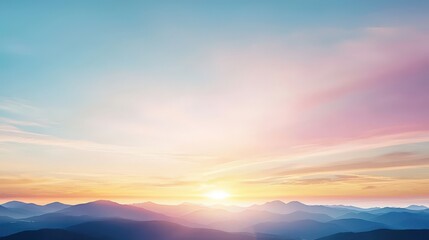 Fototapeta premium A beautiful mountain range with a bright orange sun in the sky