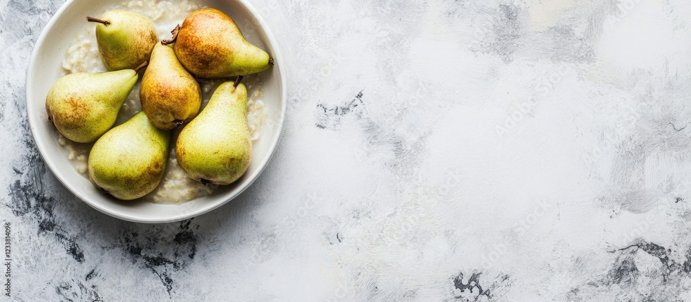Aufkleber fresh green pears in a bowl on a light textured surface with ample copy space for text placement