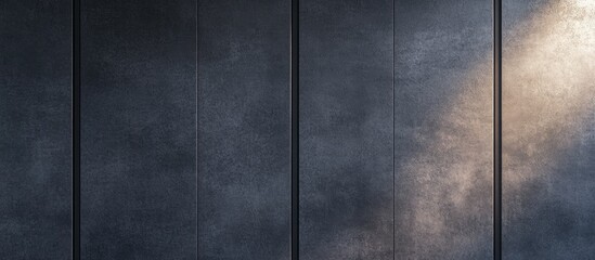 Dark textured wall with soft light gradient providing ample copy space for text or design elements.
