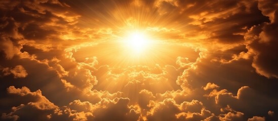 Dramatic sunset cloudscape radiating warm light with ample empty space for text or graphic overlays in a serene atmospheric setting