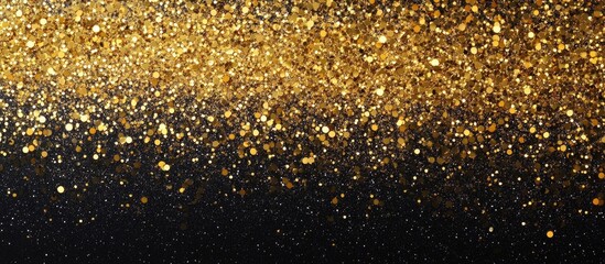 Golden glitter texture on a black background with abstract bokeh effect and copy space for text or design elements