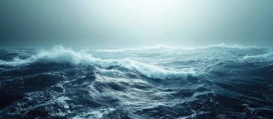 Fototapeta premium Majestic ocean waves rolling in over a serene rocky shoreline with ample blank space ideal for overlaying text or graphics.