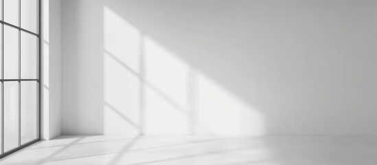 Fototapeta premium Empty room interior with large windows casting shadows on white walls and floor, Copy Space for design elements