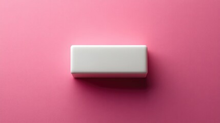 Minimalist rectangular white object against a soft pink background showcasing contemporary design and typography concepts.