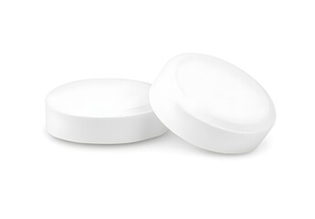 White tablet on a white background, isolated on a transparent or clean white background with a clipping path. The pill is round and has no label. Close-up view of two pills, one lying down and 
