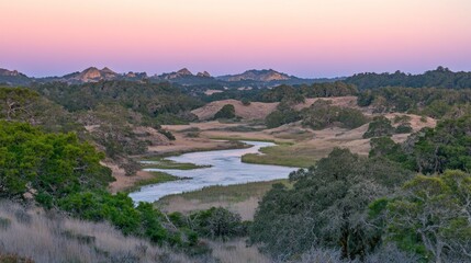 Serene sunset over a meandering river in a tranquil valley landscape.