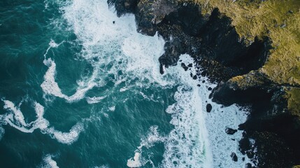 Vibrant aerial view of coastal landscape with crashing waves on rocky shoreline and clear copyspace for text and branding elements