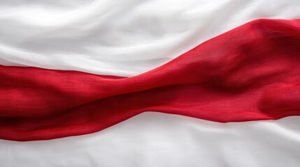 Naklejka premium Close-up of a red and white fabric with draped folds.